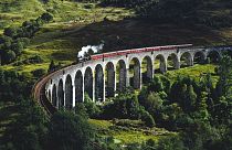 The luxury Royal Scotsman train travels across the iconic Glenfinnan Viaduct