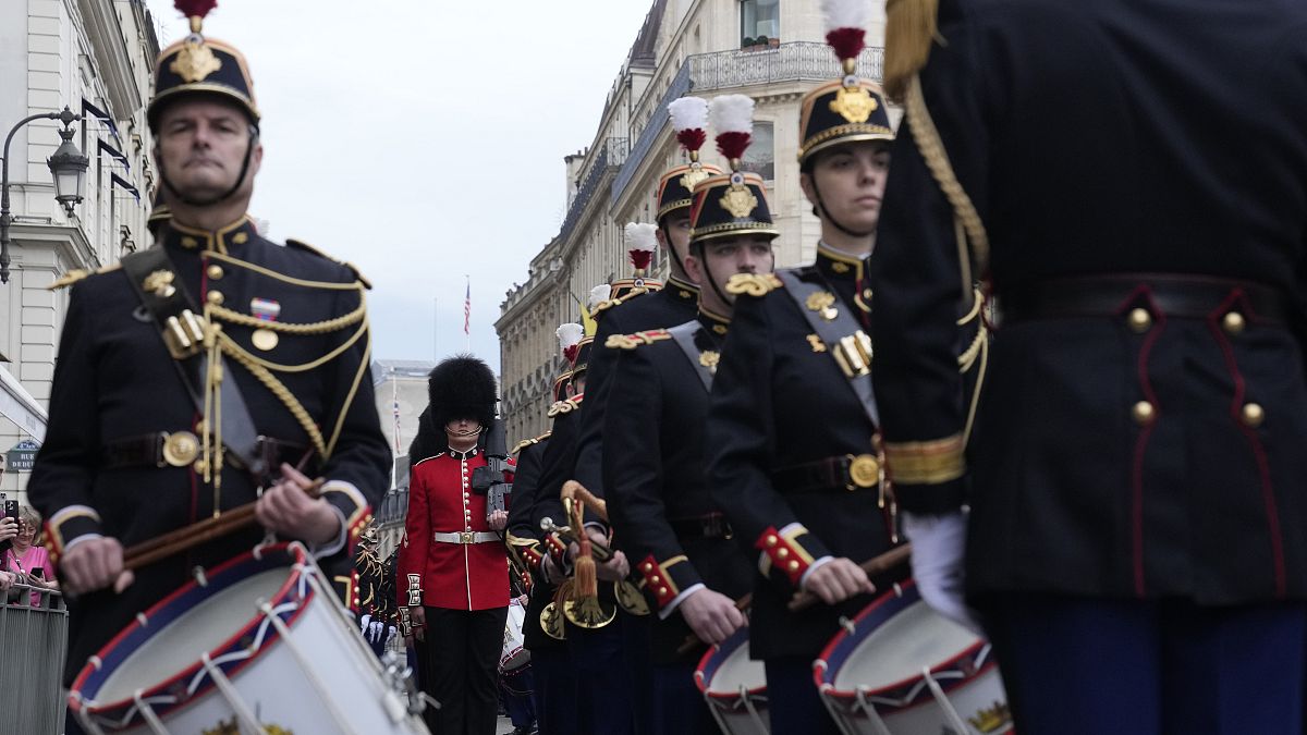 Changing of the Guards: British and French troops trade places to mark 120 years of Entente Cordiale thumbnail