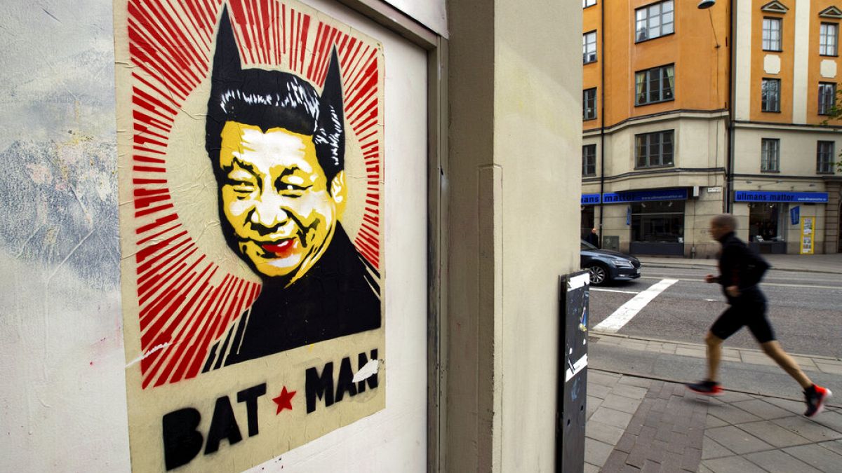A poster depicting Chinese President Xi Jinping with two pointed ears underlined by the words "BAT MAN" on a street in Stockholm, Wednesday, May 6, 2020..