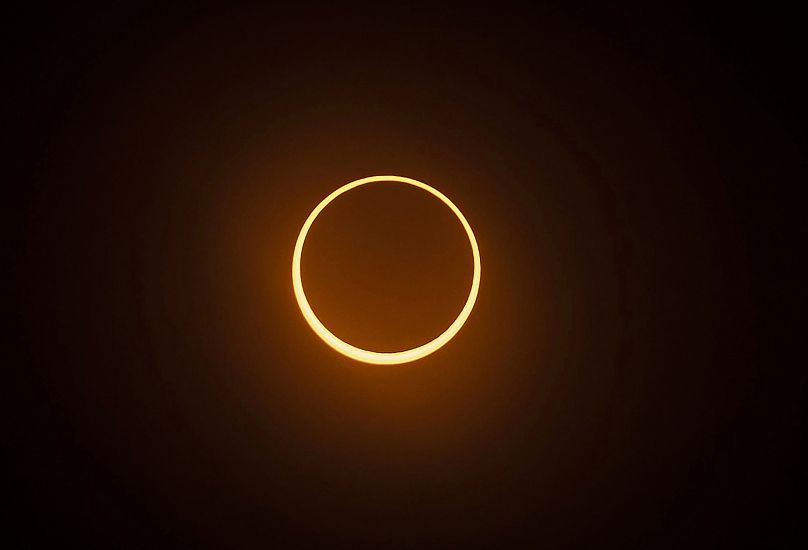 The "ring of fire" annular eclipse during the Albuquerque International Balloon Fiesta in Albuquerque, New Mexico, US.