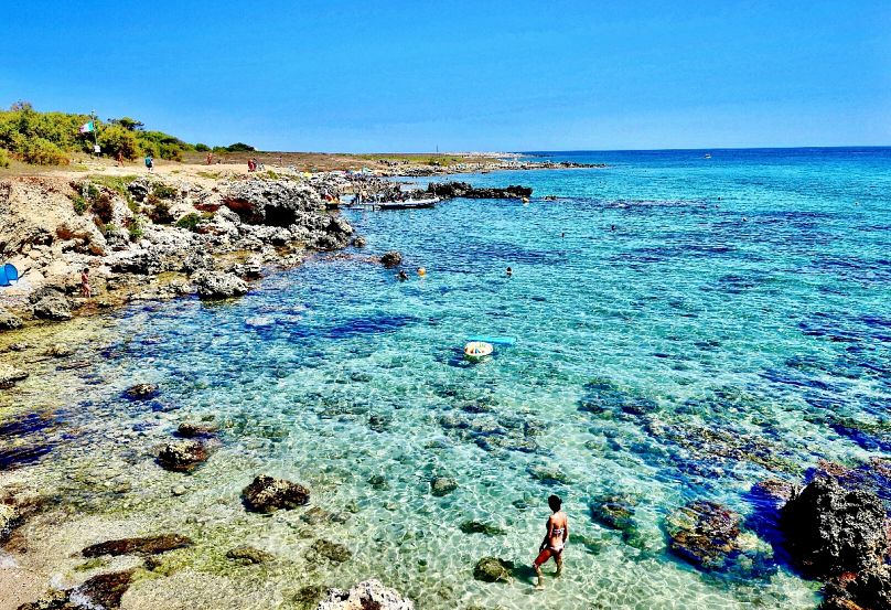 Dive into the crystal clear waters of Spiaggia di Baia dell’Orte in Salento