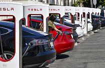 Drivers charge their Teslas in Santa Ana, Calif., on Wednesday, March 20, 2024. 