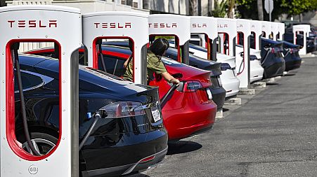 Drivers charge their Teslas in Santa Ana, Calif., on Wednesday, March 20, 2024. 