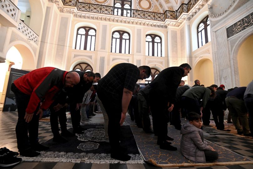People pray at the historic Yeni Cami, or New Mosque, in the port city of Thessaloniki, northern Greece, Wednesday, April 10, 2024.