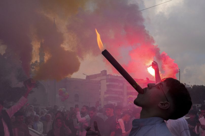 Muslims light flares as they celebrate Eid al-Fitr outside al-Seddik mosque in Cairo, Egypt, Wednesday, 10 April 2024
