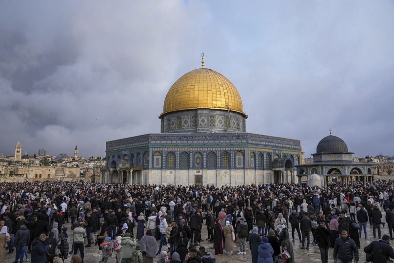 Palestinians gather for Eid al-Fitr prayers by the Dome of the Rock shrine in the Al Aqsa Mosque compound in Jerusalem's Old City, Wednesday, April 10, 2024.