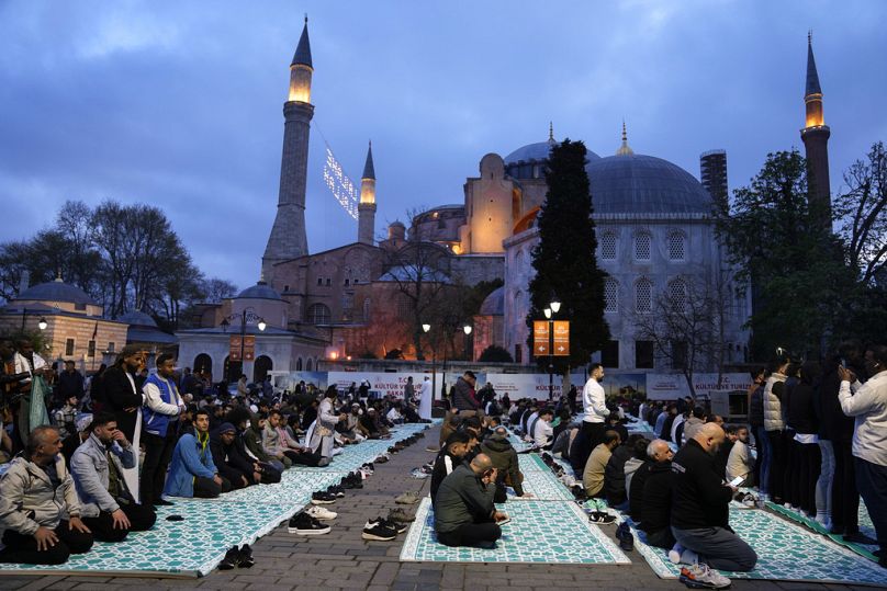 Muslims attend the prayer of the first day of Eid al-Fitr, outside the iconic Haghia Sophia mosque in Istanbul, Turkey, Wednesday, April 10, 2024.