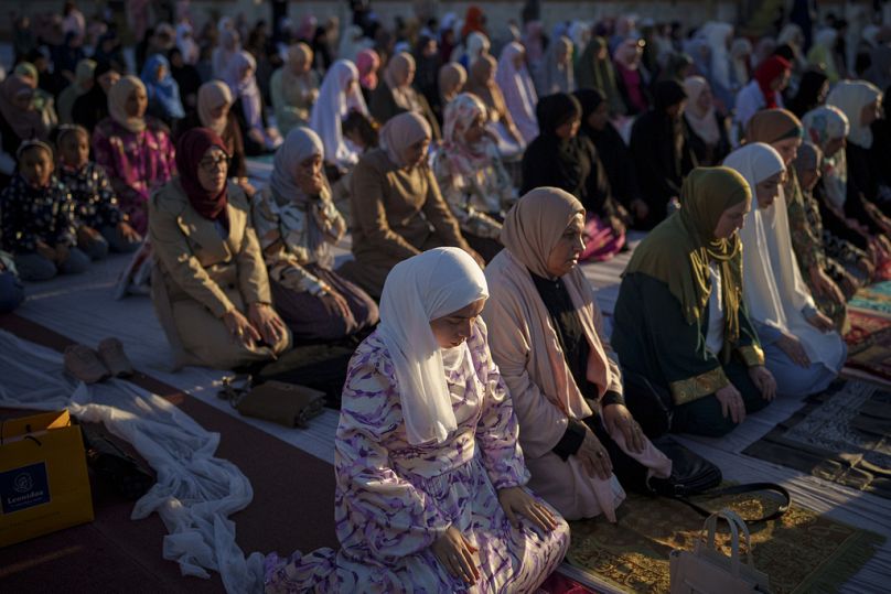 Muslim women take part in Eid al-Fitr prayers in Bucharest, Romania, Wednesday, April 10, 2024