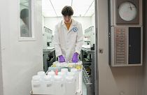 Jackson Quinn brings PFAS water samples into a temperature controlled room, 10 April 2024, at a US Environmental Protection Agency lab in Cincinnati.