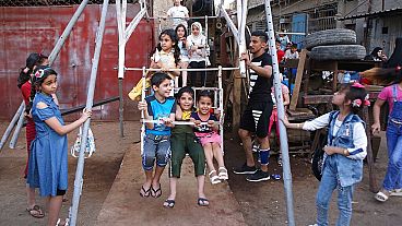 Children enjoy a ride during Eid al- Fitr celebrations, that marks the end of the Muslim holy fasting month of Ramadan, in the Fadhil neighborhood or Baghdad, Iraq, Wedsnday.