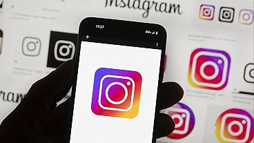 The Instagram logo is seen on a cell phone in Boston, USA, Oct. 14, 2022.