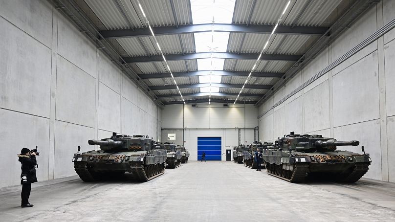 A view of Leopard 2 tanks at a production line as German Chancellor Olaf Scholz and Defence Minister Boris Pistorius visit the future site of an arms factory.
