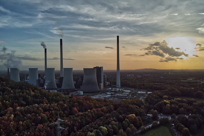 The sun sets behind the cole-fired power plant 'Scholven' of the Uniper energy company in Gelsenkirchen, Germany, on Oct. 22, 2022.