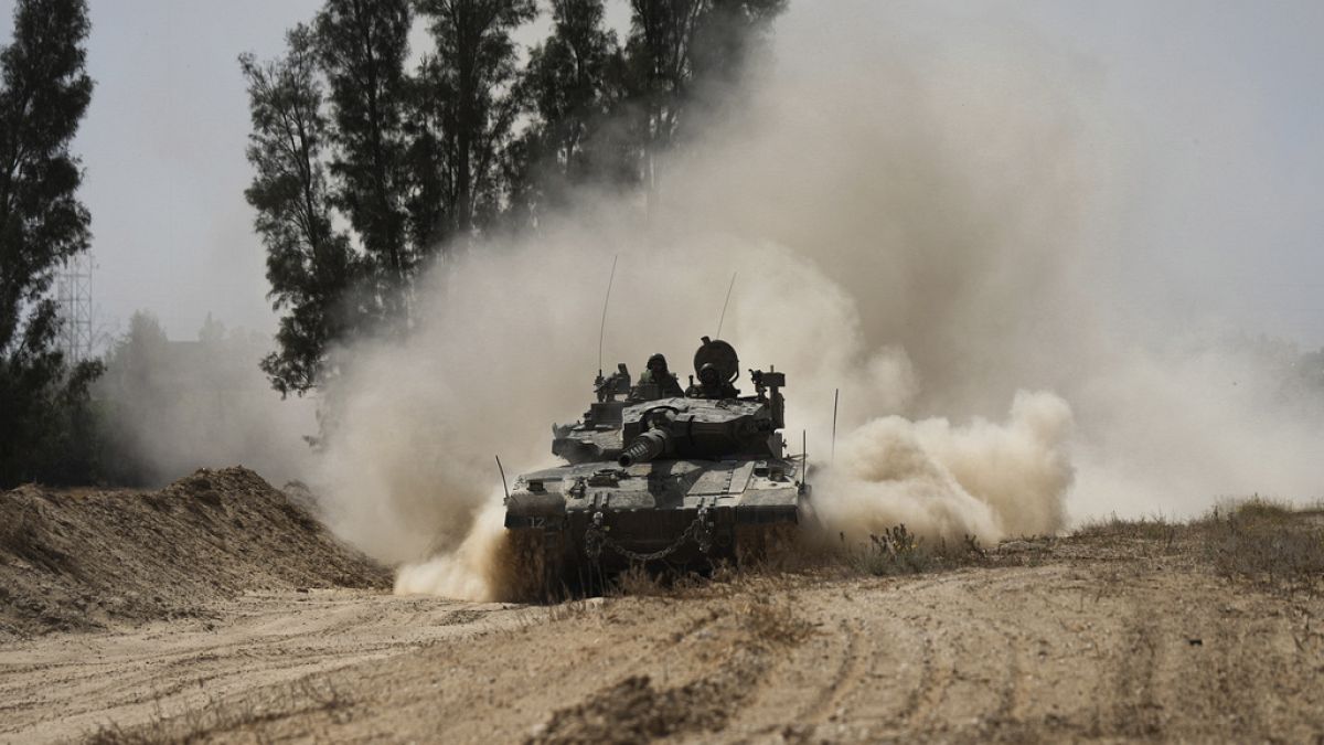 An Israeli tank moves near the Gaza Strip border in southern Israel, Thursday, April 11, 2024.