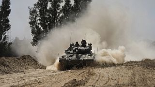 An Israeli tank moves near the Gaza Strip border in southern Israel, Thursday, April 11, 2024.