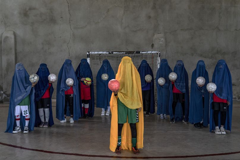 An Afghan women's football team poses for a photo in Kabul, September 2022