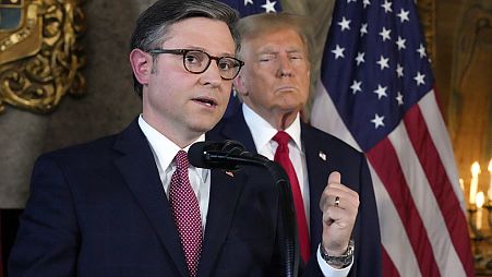 Speaker of the House Mike Johnson speaks as Republican presidential candidate former President Donald Trump listens during a news conference