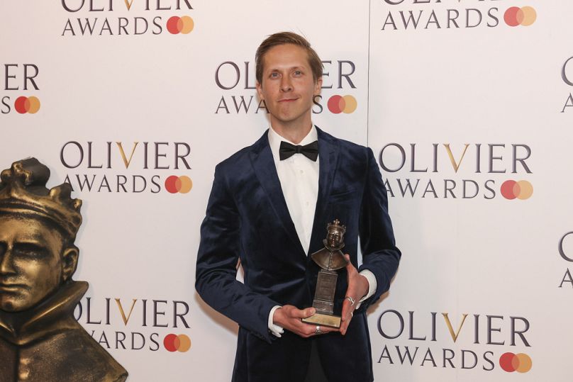 Will Close, winner of the best actor in a supporting role award for "Dear England" poses for photographers in the winner's room during the Olivier Awards on 14 April 2024.