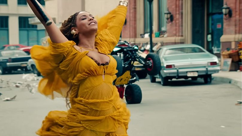 Beyoncé's iconic yellow dress in her music video "Hold Up" from her album "Lemonade" was designed by Roberto Cavalli.