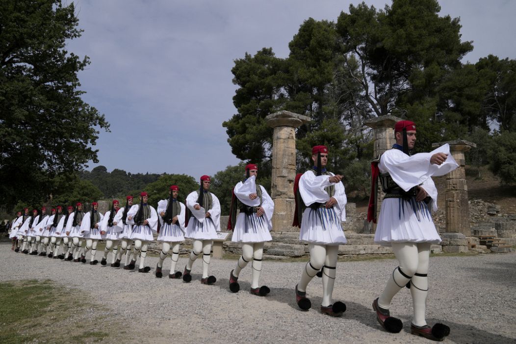Greek Presidential Guard soldiers enter the grounds for the official ceremony of the flame lighting for the Paris Olympics.