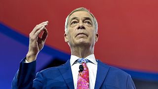 Nigel Farage was delivering a speech on stage while the Brussels police intervened to shut down the event.