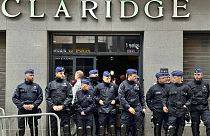 Police stand guard outside the front entrance of the event venue as the National Conservatism conference takes place in Brussels, Tuesday, April 16, 2024. 