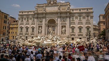 Tourists visit the Trevi Fountain in Rome, on June 30, 2023. 
