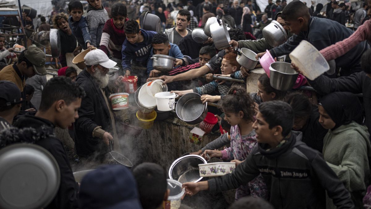  Palestinians line up for a meal in Rafah, Gaza Strip, Thursday, Dec. 21, 2023. The United Nations appealed for $2.8 billion on Tuesday, April 17, 2024.