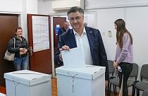 Prime Minister incumbent Andrej Plenkovic casts his ballot at a polling station in Zagreb, Croatia, Wednesday,.