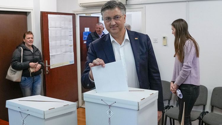 Prime Minister incumbent Andrej Plenkovic casts his ballot at a polling station in Zagreb, Croatia, Wednesday,.