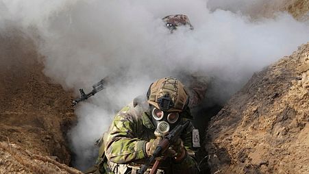 Ukrainian National guard soldiers simulate assault operations