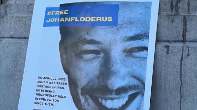 Poster of Johan Floderus at event in Brussels demanding his release