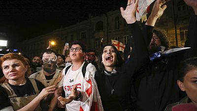 Demonstrator shouts during a rally outside the parliament building in Tbilisi, Georgia, on Thursday, April 18, 2024, to protest against "the Russian law"
