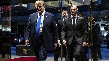 Republican presidential candidate Donald Trump arrives with Poland's President Andrzej Duda at Trump Tower in New York, Wednesday, April 17, 2024.