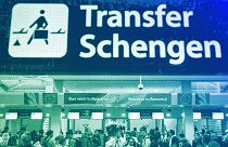 Passengers arriving at the Henri Coanda International Airport pass under a Schengen Information sign, in Otopeni, near Bucharest, March 2024