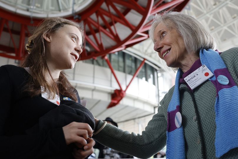 Swiss member of Senior Women for Climate Rosmarie Wydler-Walti talks to Swedish climate activist Greta Thunberg after the European Court of Human Rights' ruling, April 2024