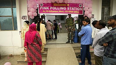 People wait in a queue at a Pink Polling Station, where all the polling officials are women, to cast their vote during the first round of polling of India's national election 