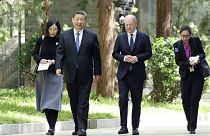 Chinese President Xi Jinping, second from left, and German Chancellor Olaf Scholz, second from right, walk together in Beijing, China, on Tuesday, April 16, 2024. 