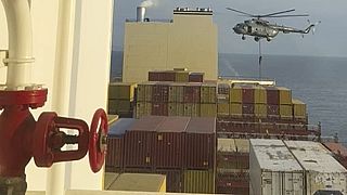 A video seen by The Associated Press shows commandos raiding a ship near the Strait of Hormuz by helicopter on 13 April