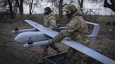 FILE - Ukrainian soldiers with the 22nd Mechanized Brigade prepare to launch mid-range drone near the city of Bakhmut in Ukraine’s Donetsk region on March 26, 202