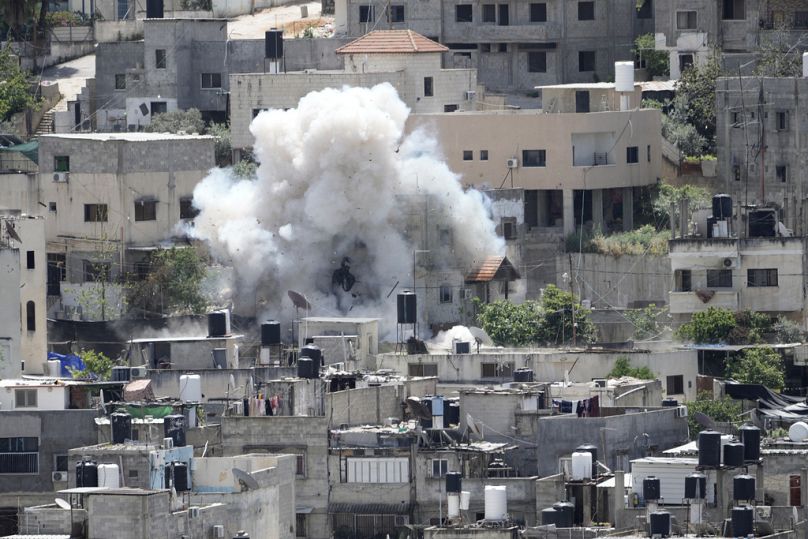 Smoke rises from an explosion during an Israeli military raid in the Nur Shams refugee camp, near the West Bank town of Tulkarem, Saturday, April 20, 2024