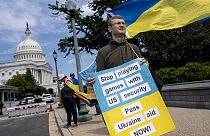 Activists supporting Ukraine demonstrate outside the Capitol in Washington, Saturday, April 20, 2024, 