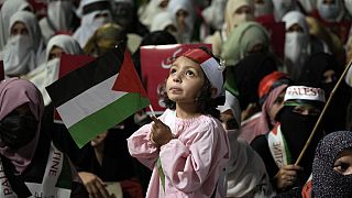 Supporters of the religious party Jamaat-e-Islami take part in a rally against Israeli airstrikes on Gaza and to show solidarity with the Palestinians, in Lahore, Pakistan