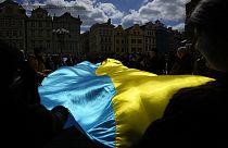 People wave with Ukrainian flag during a demonstration in support of Estonian military strategic plan for Ukraine, Czech Republic, April 21, 2024. 