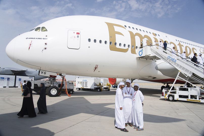Happier times: Emirati men stand in front of an Emirates' Airbus A380 double-decker jumbo jet at the Dubai Air Show in Dubai in November 2023