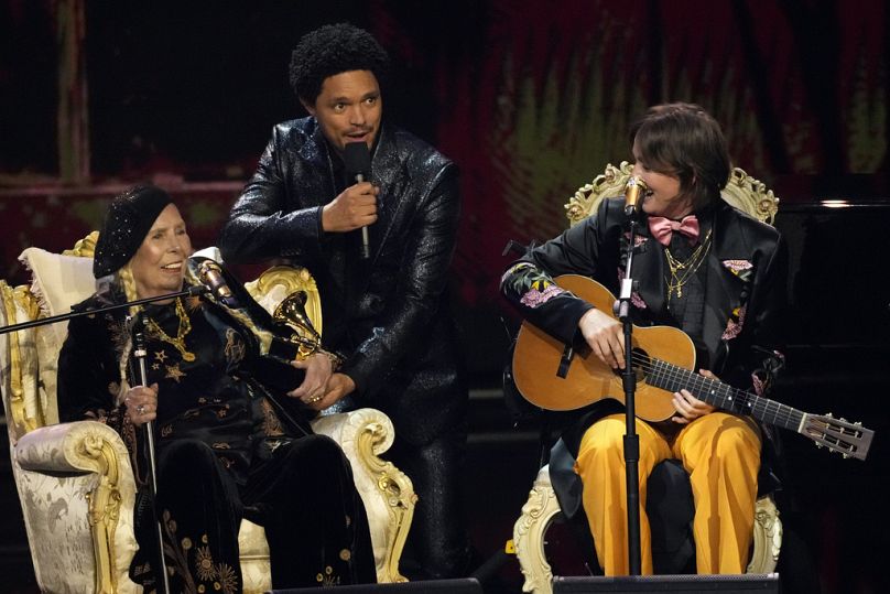 Joni Mitchell, host Trevor Noah, and Brandi Carlile appear during the 66th annual Grammy Awards, February 2024