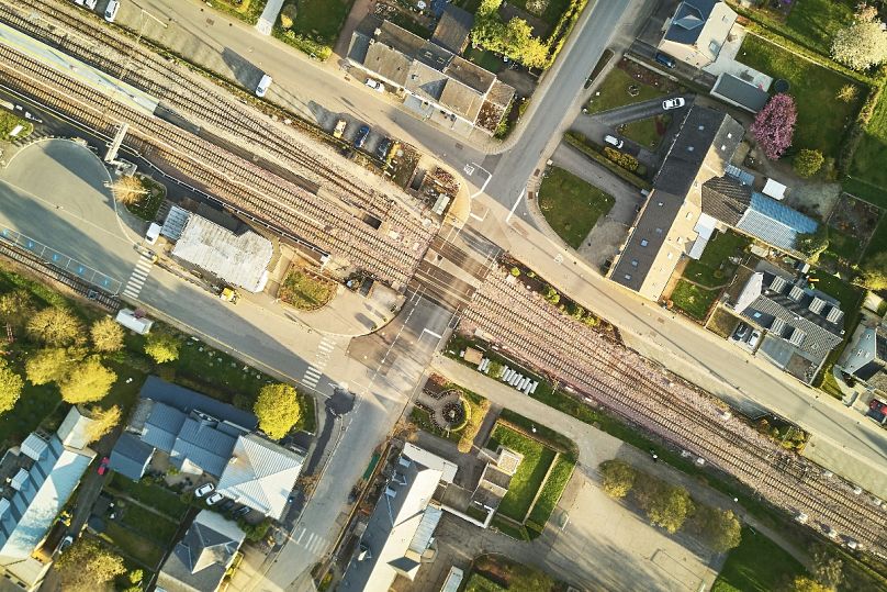 View from above: A railway crossing in a small town in Luxembourg