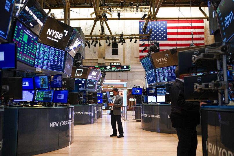 Traders work on the floor at the New York Stock Exchange in New York, September 2022