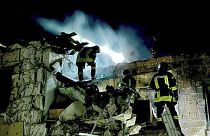 Firefighters work on the site of a burning building after a Russian drone attack in Odesa, Ukraine.