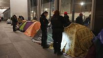 Police evict migrants from a makeshift tent camp in Paris